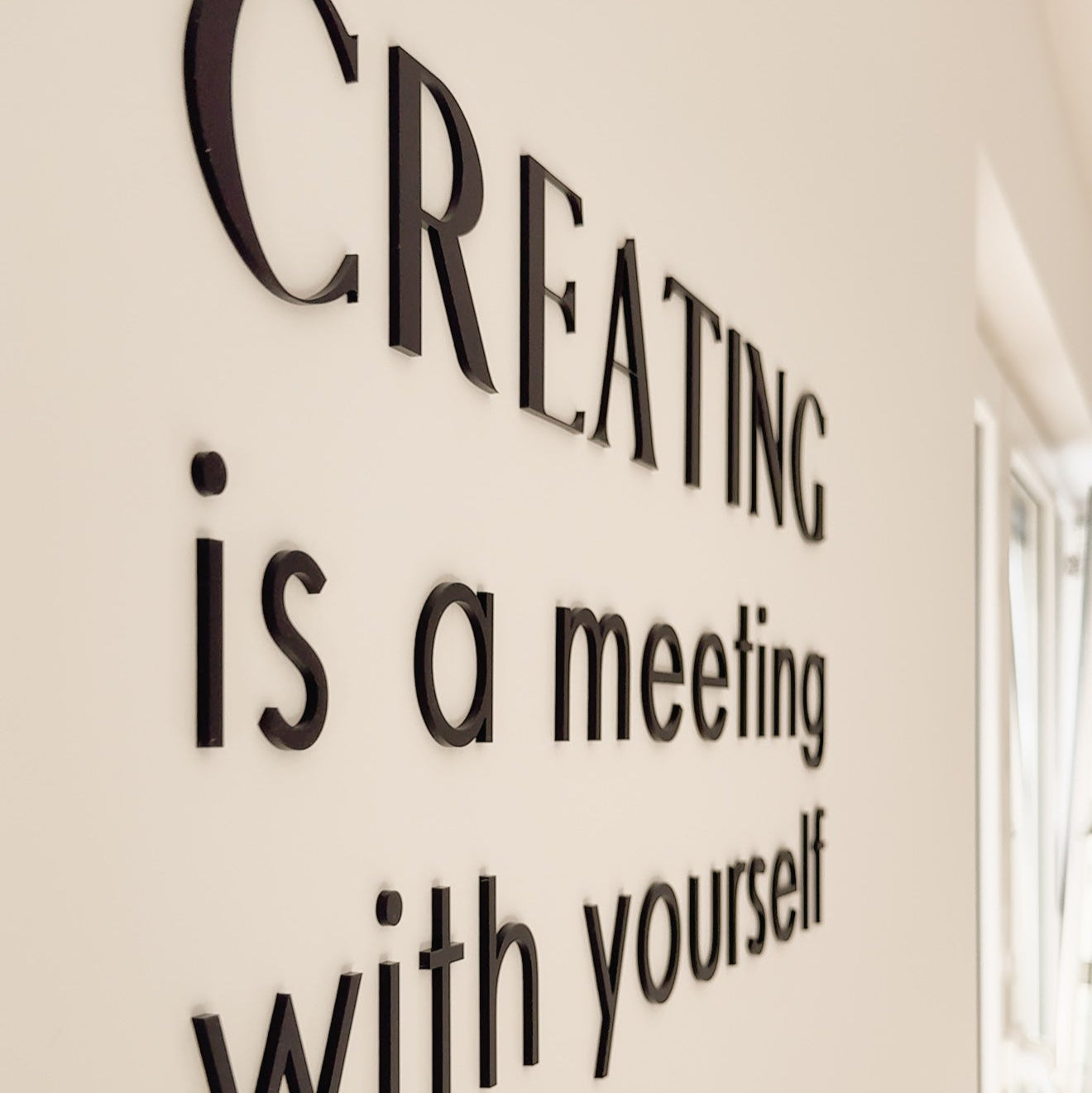 Wandschriftzug "creating is a meeting with yourself"